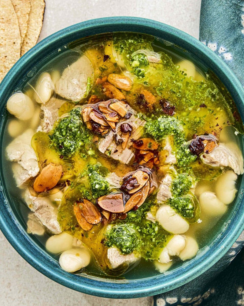 Mexican Brothy Beans and Pork With Salsa Macha and Cilantro Pesto