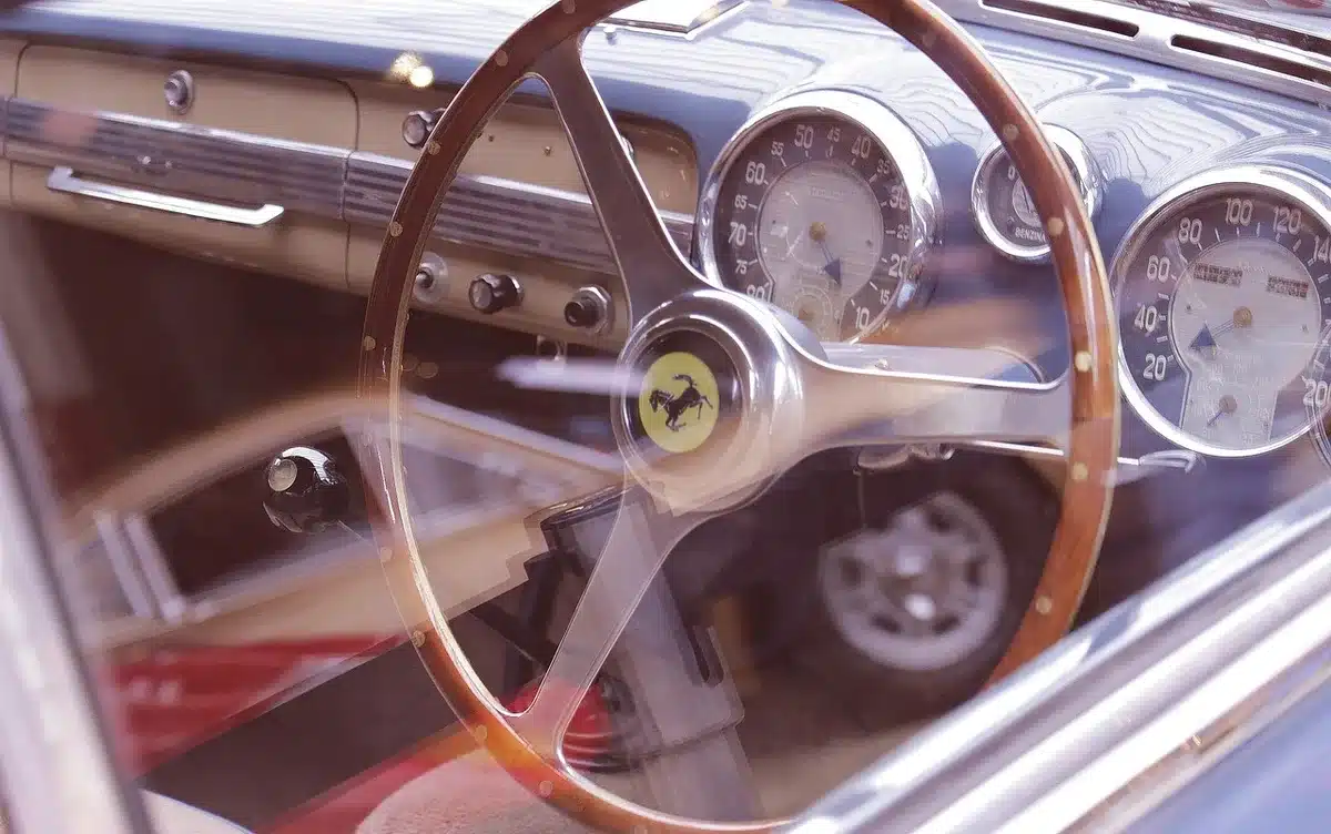 Interior showing striped upholstery and a pizza slice in a cupholder