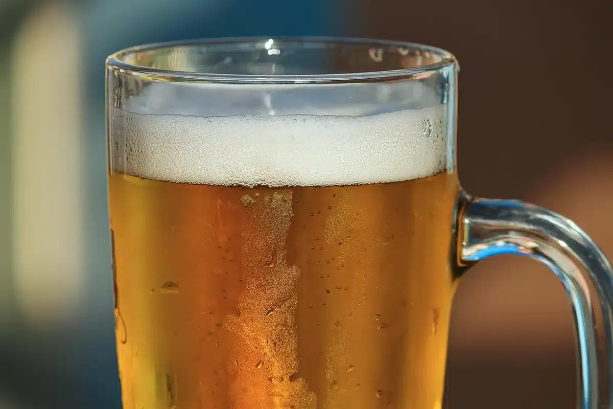 Close-up of beer in a glass showing foam and liquid to illustrate ingredients