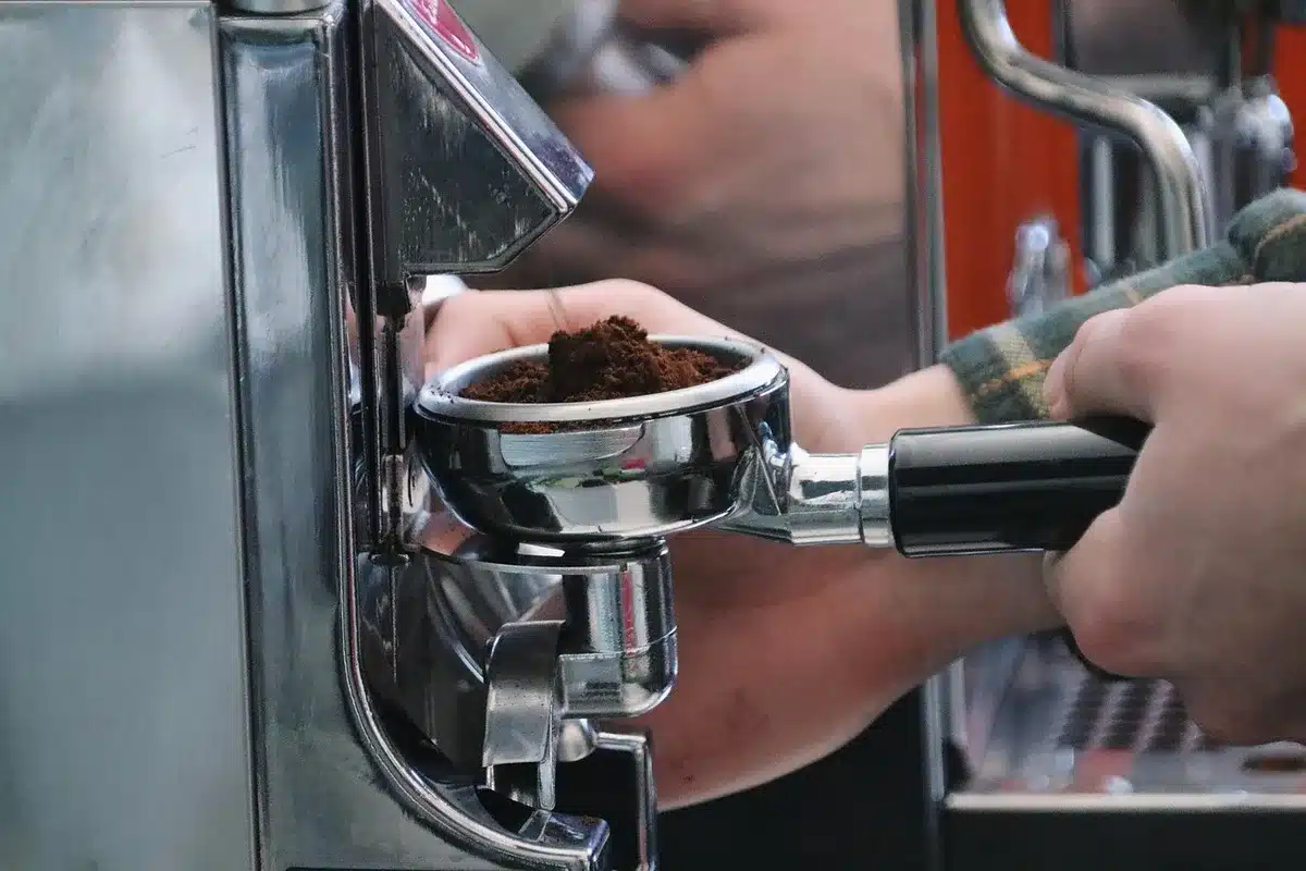 Multiple countertop coffee grinders lined up on a test bench
