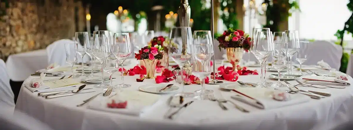 Fine dining room with white tablecloths and formal place settings
