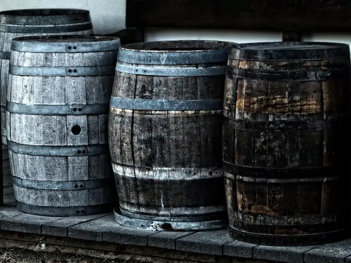 Bourbon barrels aging in a charred oak barrel warehouse