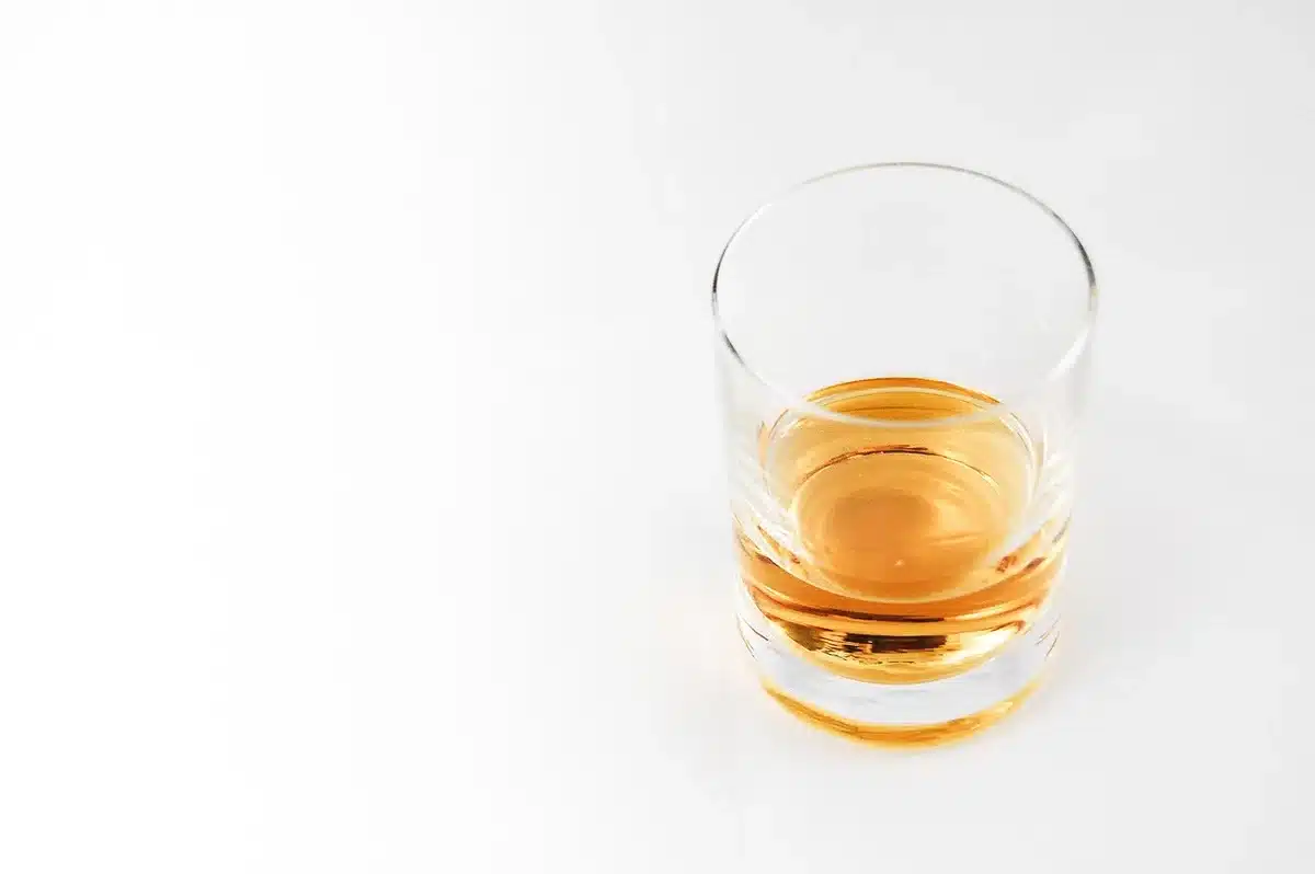 Two glasses of bourbon side by side for tasting comparison