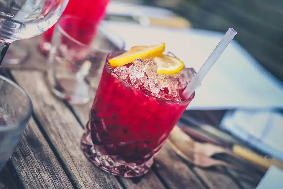 Friends enjoying cocktails outdoors during a summer gathering