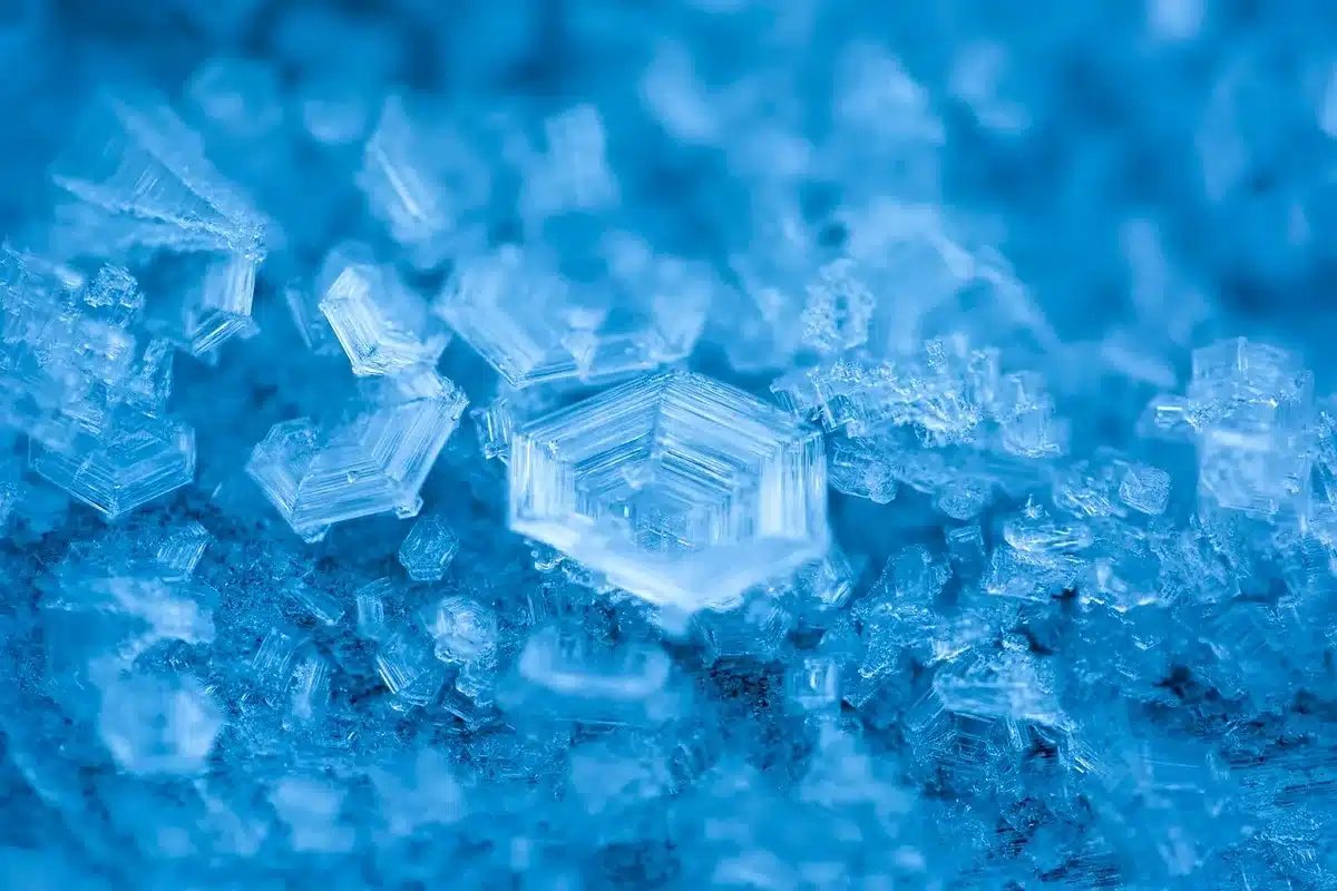 Close-up of cloudy ice showing white centers, air bubbles, and internal fissures
