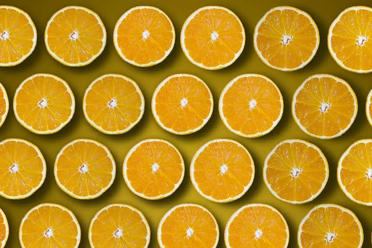 Fridge shelf with jar of fresh-squeezed citrus juice