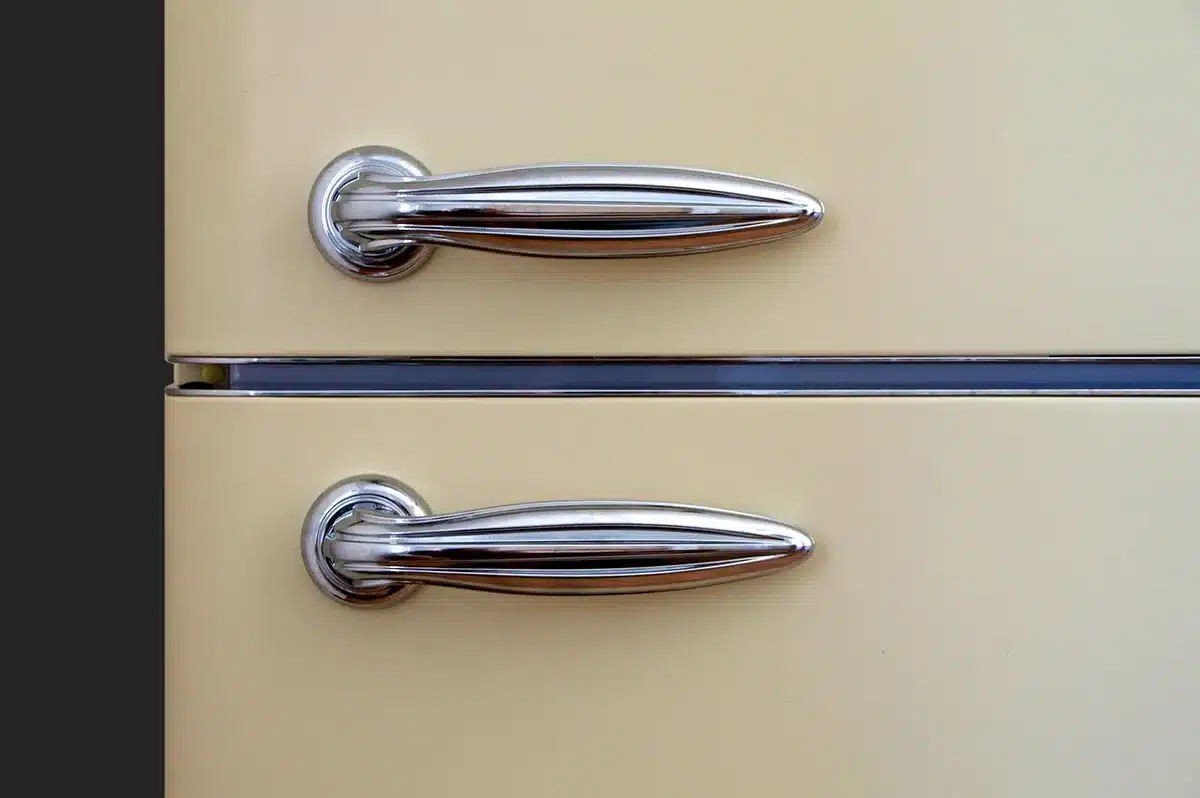 Glass cold-brew pitcher sitting in a refrigerator door shelf