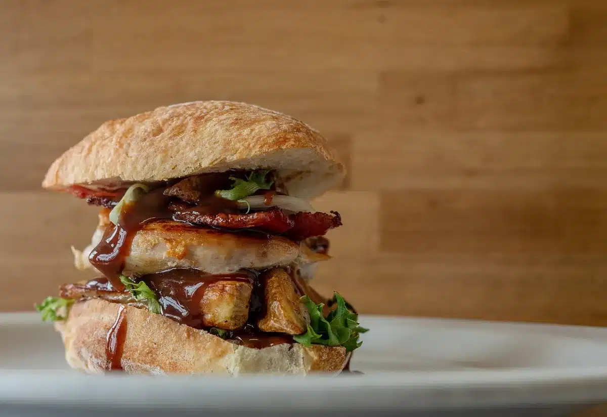Charcoal-grilled pastries and seeded flatbread on a plate, showcasing elevated comfort food
