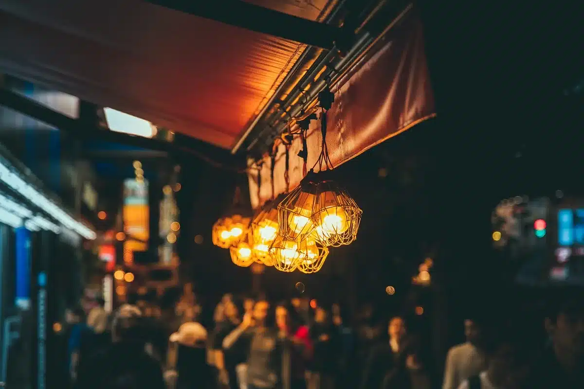 Historic counter with stools and a busy late-night atmosphere