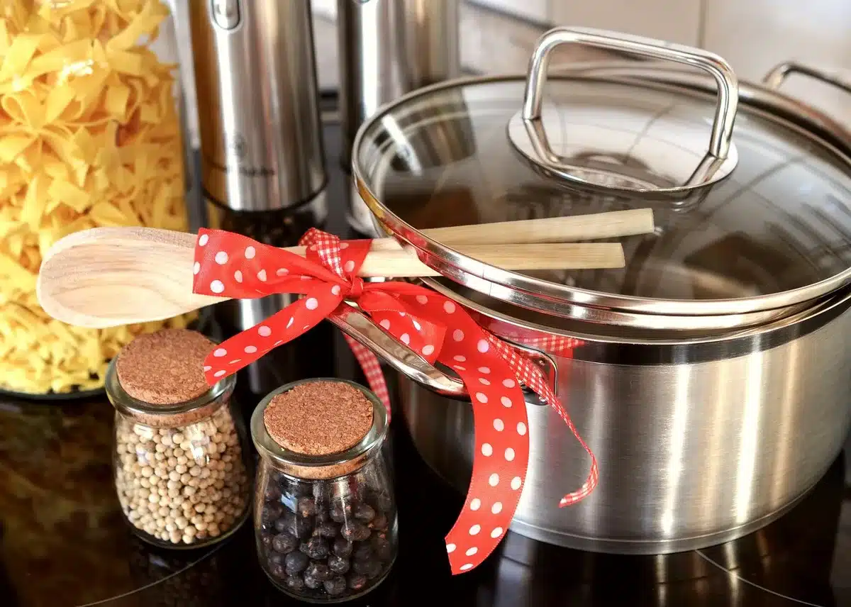 Kitchen workspace with ingredients, baking sheets, and containers ready for batch cooking breakfast items