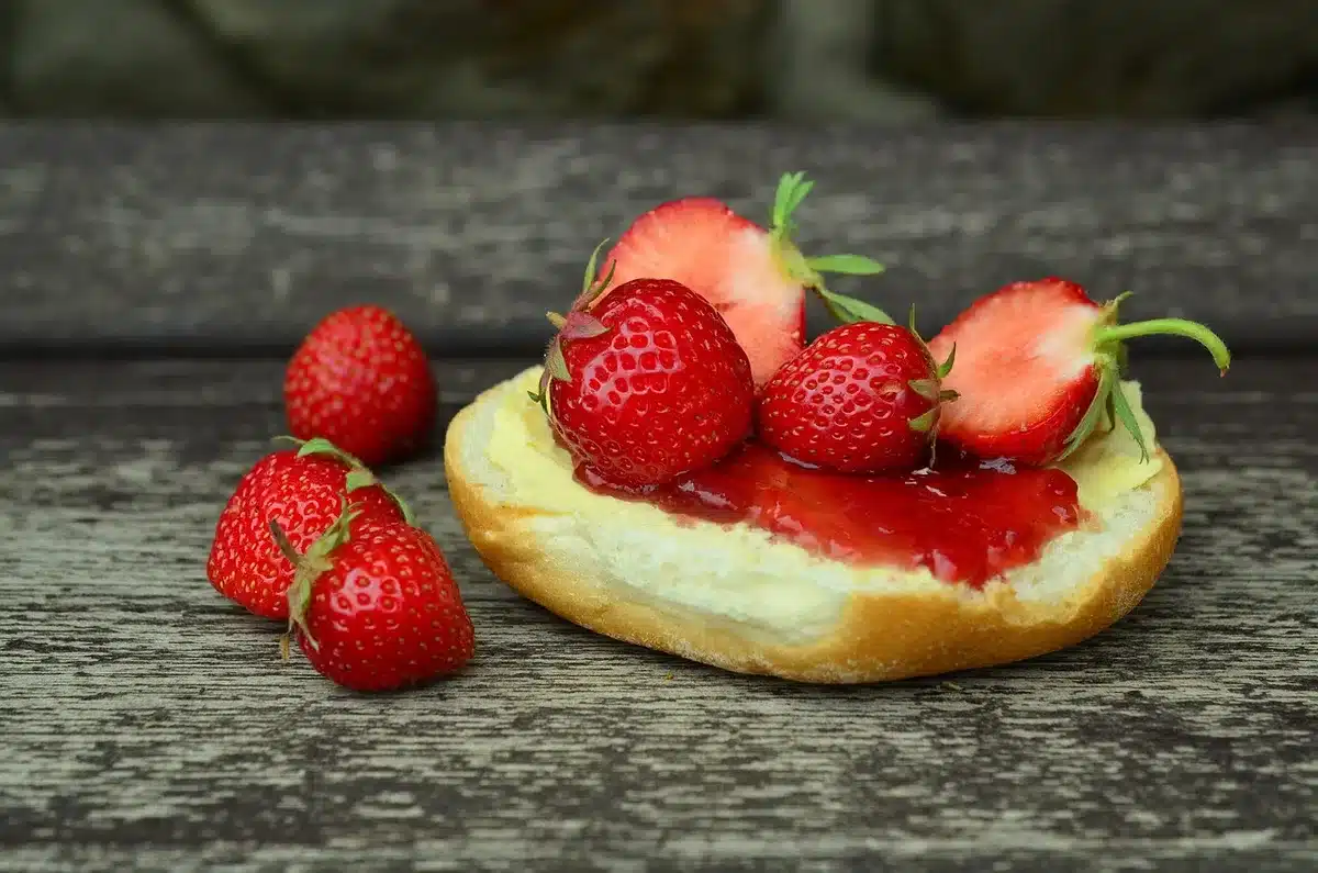 Golden-brown fry bread served with honey, jam, and powdered sugar toppings