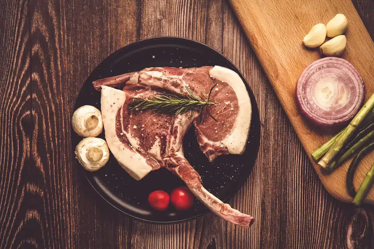 Skirt steak sliced on a plate, medium-rare, with simple garnish