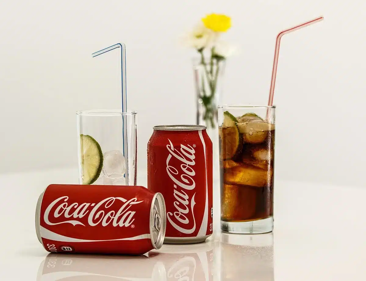 Variety of Pepsi prebiotic and low-sugar cola cans lined up together