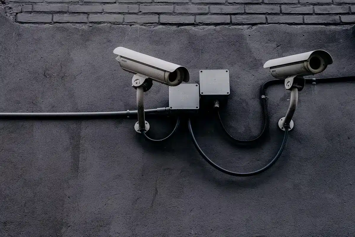 Security camera mounted above service counter monitoring transactions