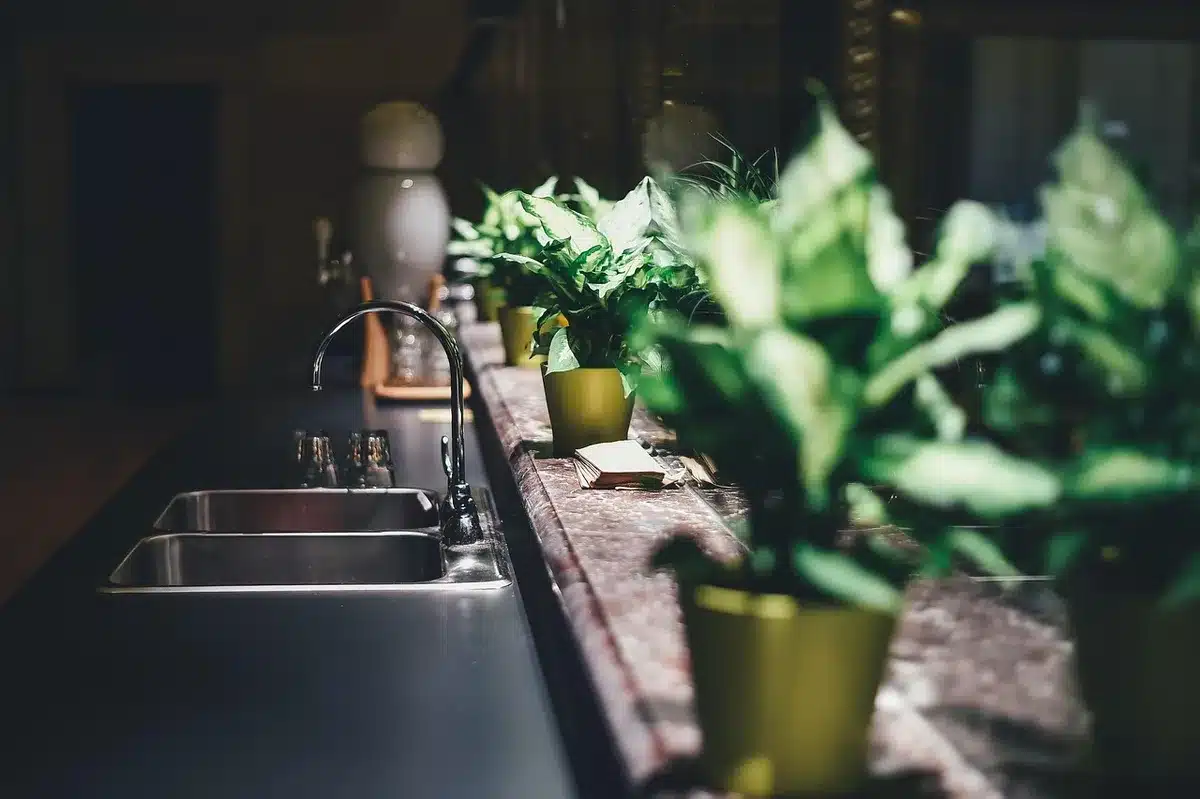 Stainless AeroPress, glass french press and moka pot on a countertop