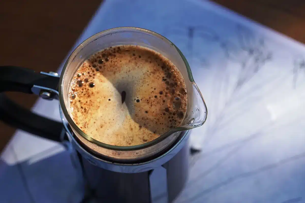 Side-by-side Keurig-style pod machine and Ninja-style single-serve drip on a counter