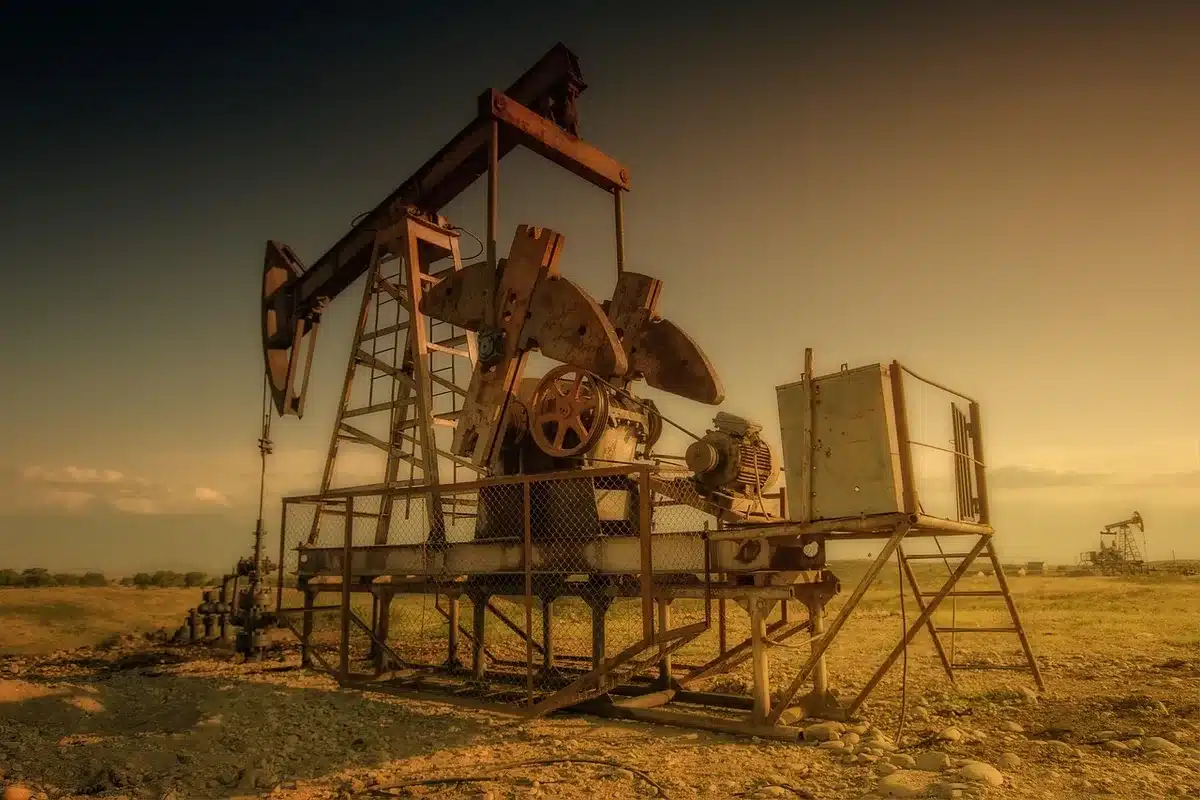Silhouette of an oil rig near open federal land