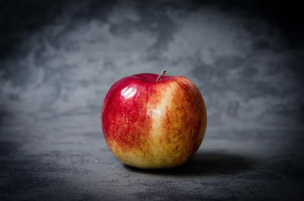 Apples stored in a refrigerator crisper inside a perforated plastic bag