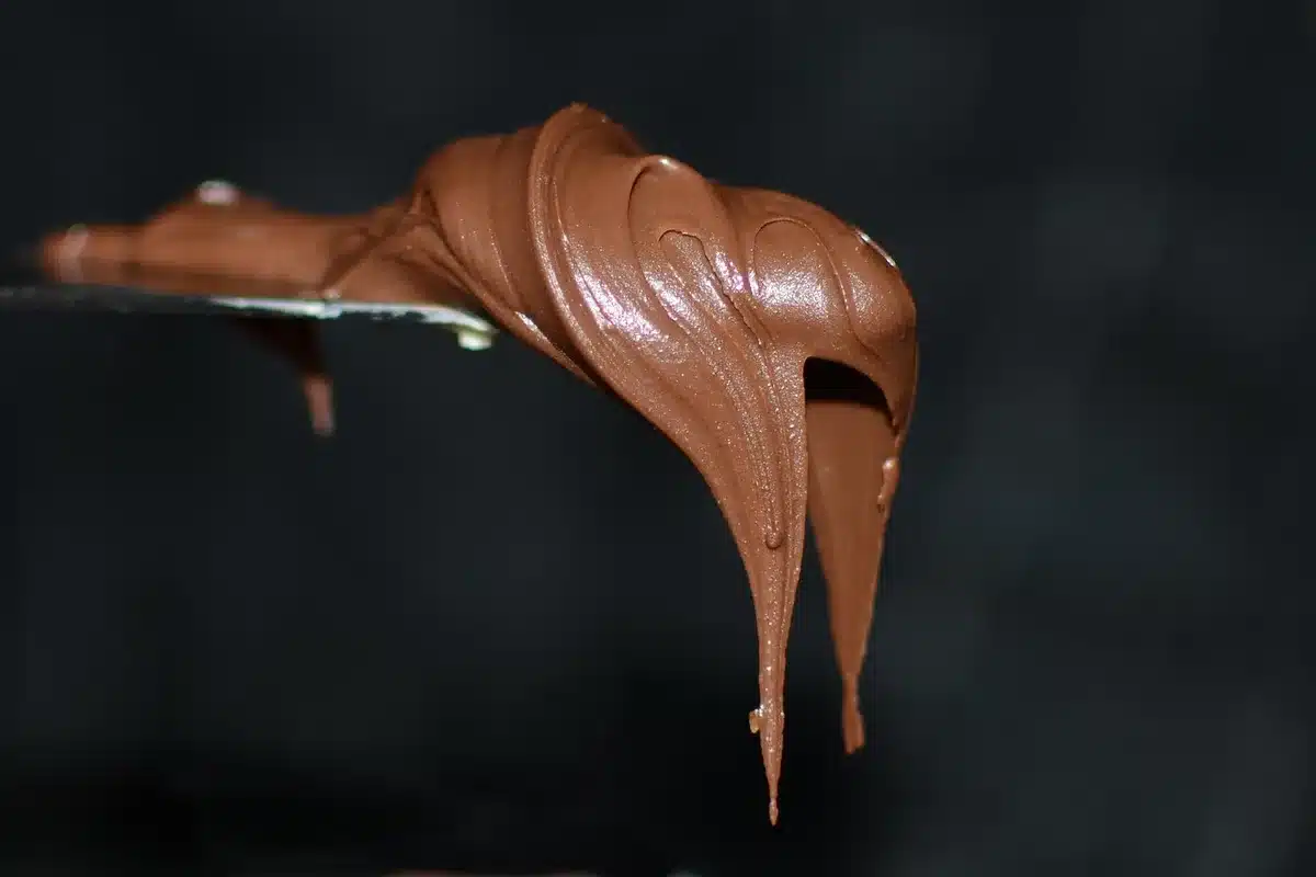 Close-up of a chocolate shake showing creamy texture and spoon