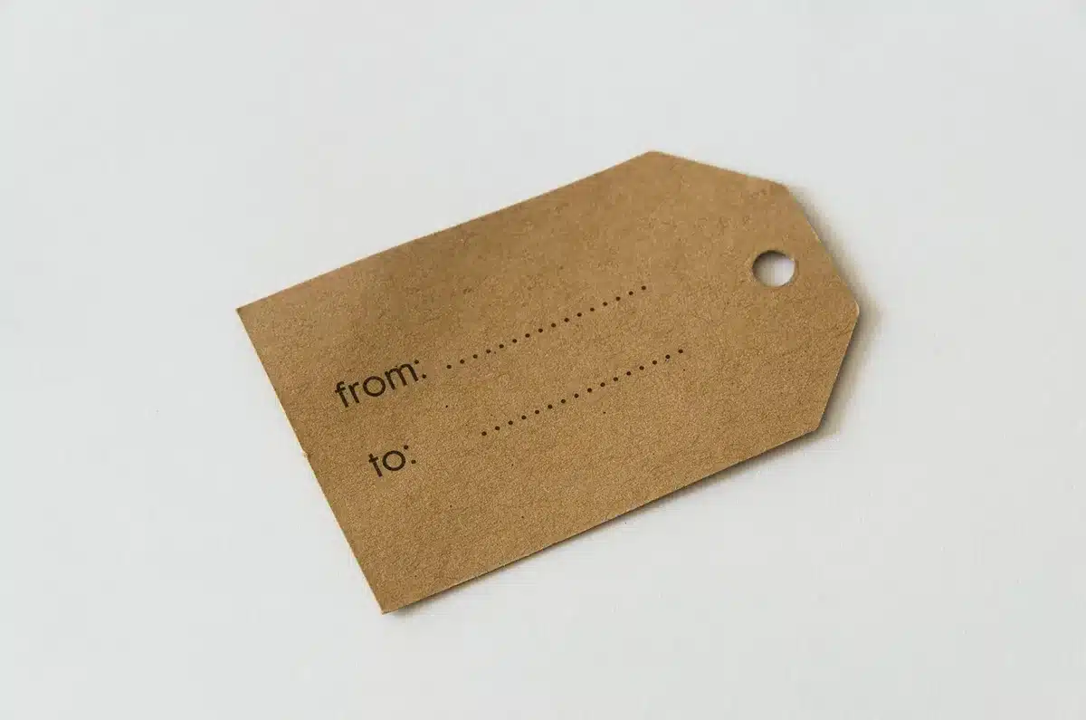 Paper label on fruit being peeled off before composting