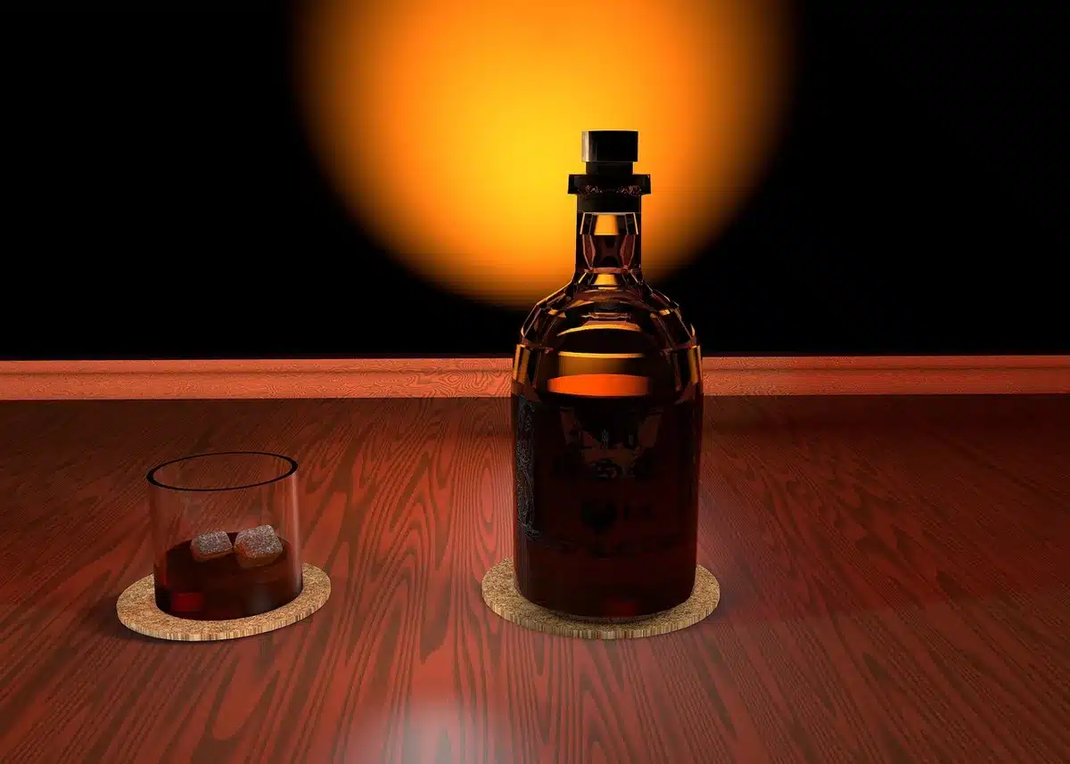 Two neat whiskey glasses showing amber spirit for tasting advice