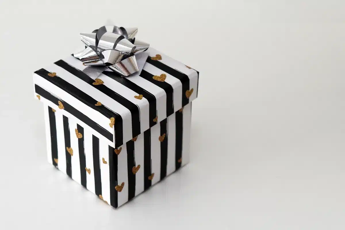 Assorted doughnuts in a gift box with themed sleeve