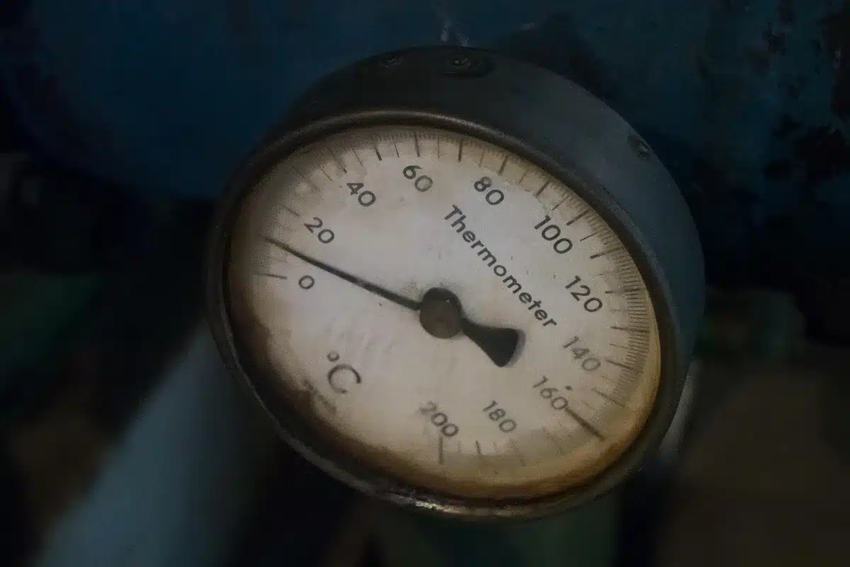 Digital refrigerator thermometer showing safe temperature below 40°F